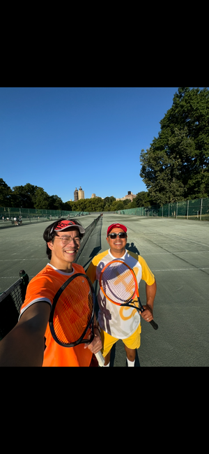 Julio and a student on court